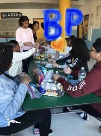 JV Girls Basketball team preparing post-game snacks for the Middle School Flag football team on 10/1/19.